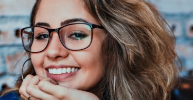 closeup photo of woman wearing black framed eyeglasses