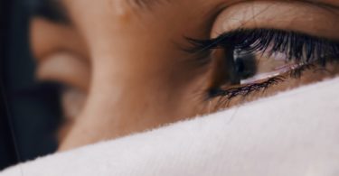 shallow focus of a woman's sad eyes