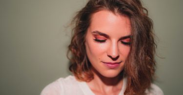 smiling woman taking selfie